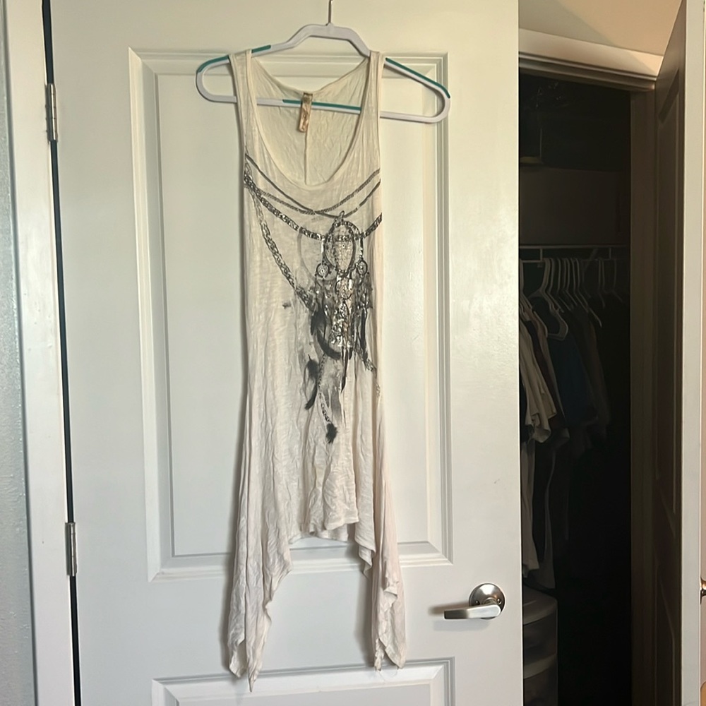 Asymmetrical white dress with dream catcher design
